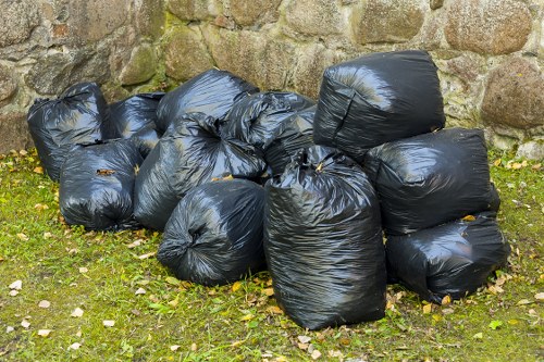 Different types of construction skips on site