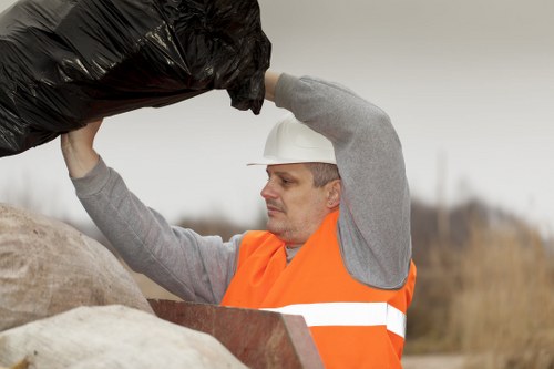 Muck away service truck collecting debris